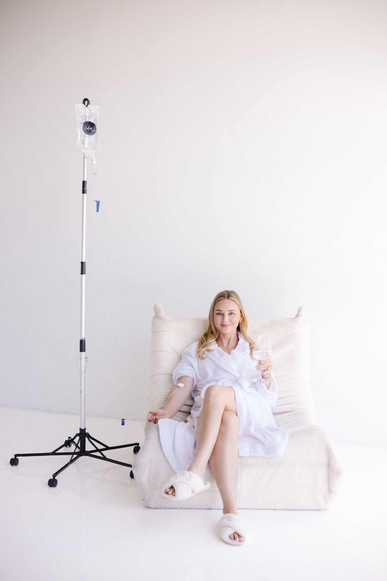 A client receiving an IV drip at home